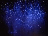Blue fireworks fill the sky